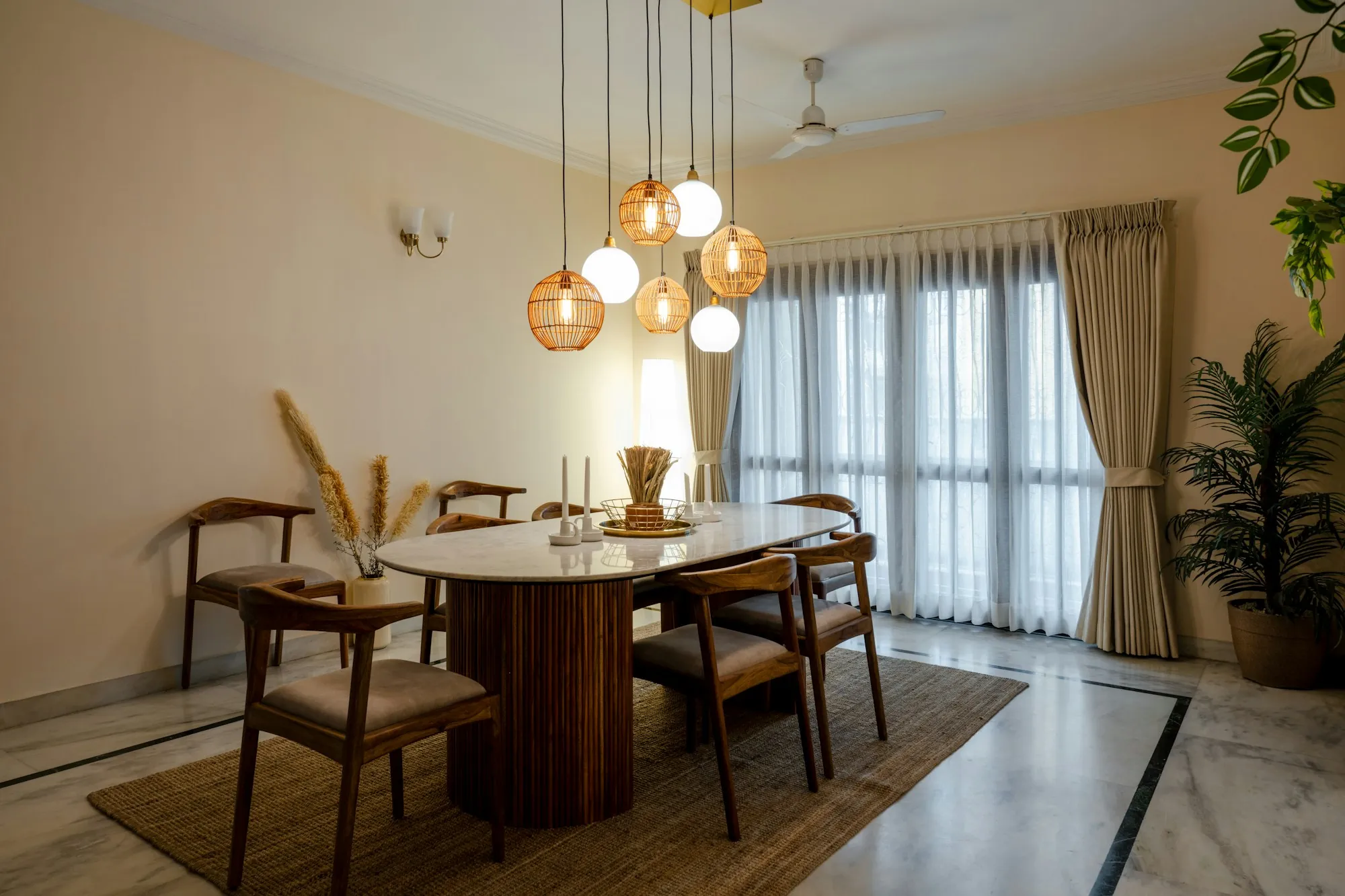 Dining room with a round table under hanging pendant lights